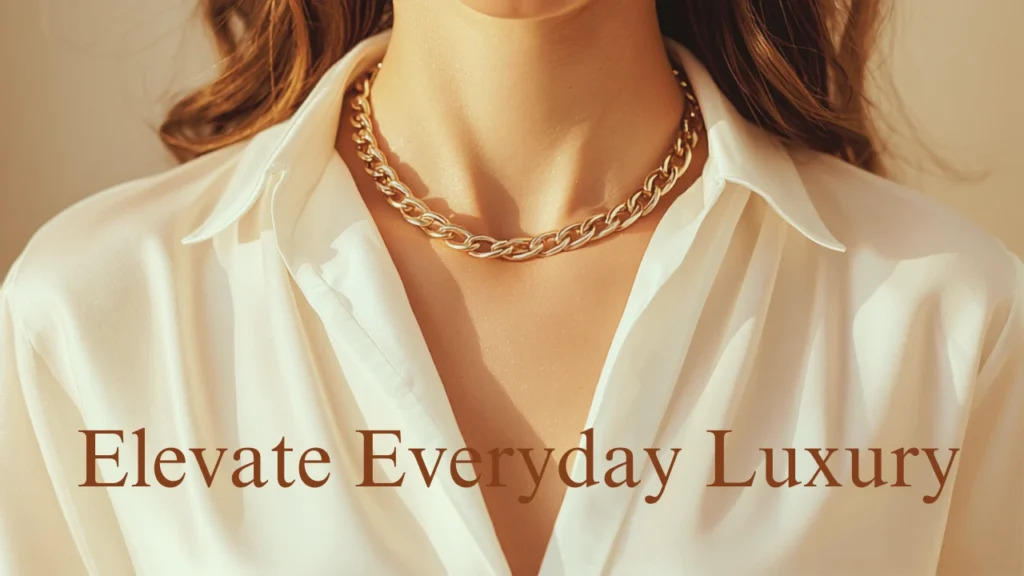 Woman wearing a gold vermeil chain necklace with a silk blouse