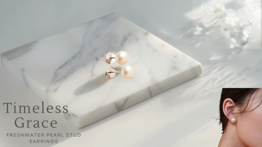 Freshwater pearl stud earrings on a minimalist marble flat lay