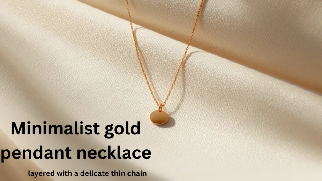 Minimalist gold pendant necklace layered with a delicate thin chain