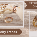 Detailed & SEO-Optimized (Recommended for Blogs/Websites) A digital mood board titled "Jewelry Trends" and "Personalized Jewelry" against a background of gentle ocean waves. On the left, a cluster of white pearls, a gold engagement ring on a silk ribbon, and a gold band studded with small diamonds sit near the water's edge. On the right, a close-up showcases an elegant, matte-finish gold ring shaped like a calla lily, accented with micro-pave diamonds.